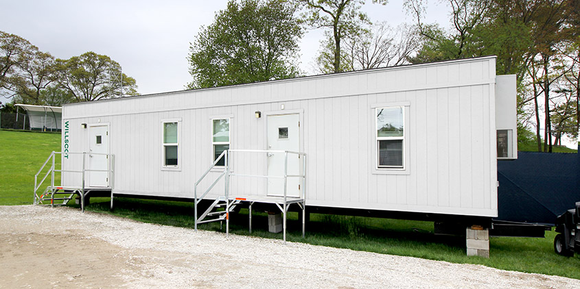 Outside view of mobile office trailer with steps